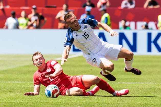 TORONTO, ON - JUNE 12: Defender Alistair Johnston (2) of Canada and midfielder Amar MemiÄ‡ (15) of Bosnia and Herzegovina collide during the first half of the FIFA World Cup, WM, Weltmeisterschaft, Fussball 2026 Group B match between Canada and Bosnia and Herzegovina on June 12, 2026, at Toronto Stadium in Toronto, ON. (Photo by Mathew Tsang Icon Sportswire) SOCCER: JUN 12 FIFA World Cup 26 Group B - Canada vs Bosnia and Herzegovina EDITORIAL USE ONLY Icon260612037