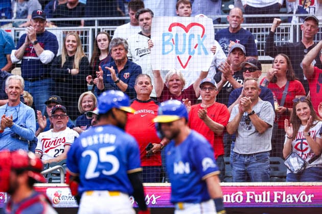 June 12th, 2026: A fan holds a sign while Minnesota Twins center fielder Byron Buxton (25) celebrates a solo home run in the first inning of a MLB, Baseball Herren, USA Baseball game between the St. Louis Cardinals and the Minnesota Twins at Target Field in Minneapolis, Minnesota. CSM Minneapolis USA - ZUMAc04_ 20260612_zma_c04_132 Copyright: xStevenxGarciax