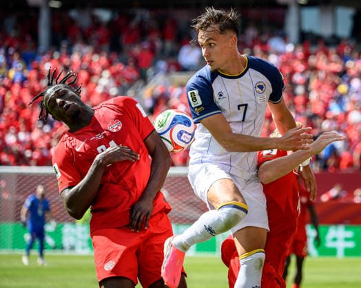 June 12, 2026, Toronto, Ontario, Canada: Canada s PROMISE DAVID (24) challenges Bosnia and Herzegovina s AMAR DEDIC (7) for possession during the FIFA World Cup, WM, Weltmeisterschaft, Fussball 2026 Group B match at Toronto Stadium. Canada scored a draw 1:1 with Bosnia and Herzegovina. Toronto Canada - ZUMAr228 20260612_znp_r228_002 Copyright: xVasiliyxRyabykhx