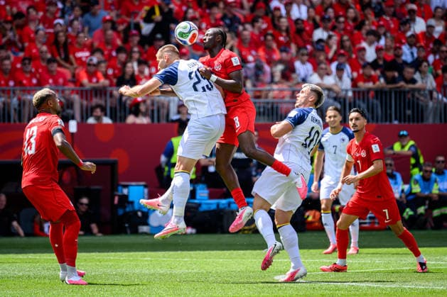 June 12, 2026, Toronto, Ontario, Canada: Toronto, Ontario, Canada Ã¢â‚¬ June 12, 2026: JOVO LUKIÄ (25) of Bosnia and Herzegovina competes for a header with CanadaÃ¢â‚¬â ¢s ISMAo¹L KONo° (8) during the FIFA World Cup, WM, Weltmeisterschaft, Fussball 2026 Group B match between Canada and Bosnia and Herzegovina at Toronto Stadium. Toronto Canada - ZUMAr228 20260612_znp_r228_019 Copyright: xVasiliyxRyabykhx
