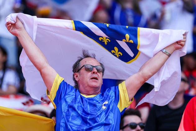 Canada v Bosnia and Herzegovina: Group B - FIFA World Cup, WM, Weltmeisterschaft, Fussball 2026 Bosnia and Herzegovina supporters cheer for their team with a flag and team jerseys during the FIFA World Cup 2026 group stage match between Canada and Bosnia and Herzegovina at Toronto Stadium in Toronto, Ontario, Canada, on June 12, 2026. Toronto Ontario Canada  Copyright: xIndrawanxKumalax originalFilename:kumala-thefifaw260612_npRNb.jpg
