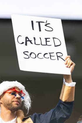 INGLEWOOD, CA - JUNE 12: A USA fan holds a sign saying IT™S CALLED SOCCER before the FIFA World Cup, WM, Weltmeisterschaft, Fussball 2026 Group D match between USA and Paraguay on June 12, 2026 at Los Angeles Stadium in Inglewood, CA. (Photo by Karl Anderson Icon Sportswire) SOCCER: JUN 12 FIFA World Cup 26 Group D - USA vs Paraguay EDITORIAL USE ONLY Icon272260612025