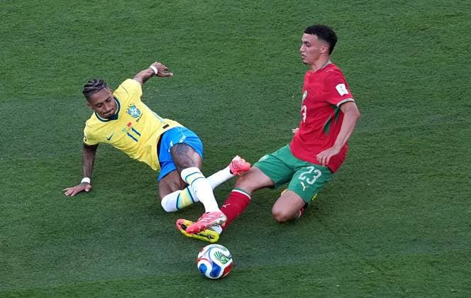 Raphinha of Brazil and Bilal El Khannouss of Morocco in action Brazil v Morocco, 2026 FIFA World Cup, WM, Weltmeisterschaft, Fussball Group C, Football, New York New Jersey Stadium, East Rutherford, New Jersey, USA - 13 Jun 2026East Rutherford New York New Jersey Stadium New Jersey (NJ) United States of America EDITORIAL USE ONLY No use with unauthorised audio, video, data, fixture lists, club league logos or live services. Online in-match use limited to 120 images, no video emulation. No use in betting, games or single club league player publications.  Copyright: xIsmaelxAdnan Shutterstockx 16924266ac