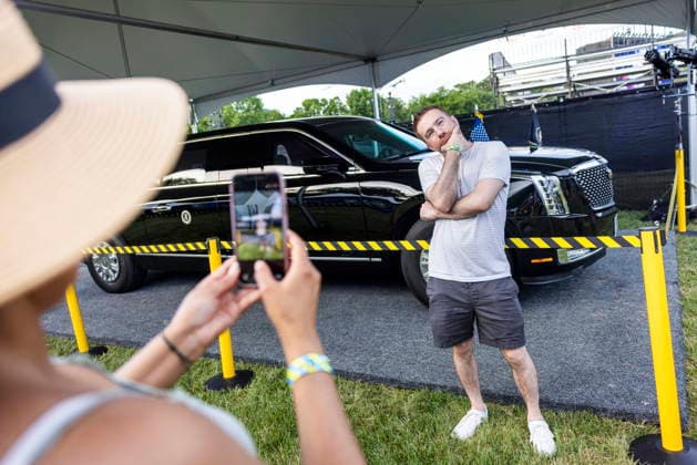 UFC Freedom 250 - Ceremonies A fan of ultimate fighting poses next to one of the presidential limousines on the Ellipse outside of the White House ahead of the UFC Freedom 250 ceremonial weigh-ins in Washington, DC, USA, 13 June 2026. The martial arts bouts are scheduled to take place on the South Lawn of the White House on 14 June. WASHINGTON DC UNITED STATES  Copyright: xJIMxLOxSCALZOx xPOOLx