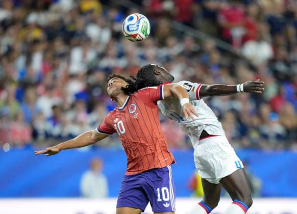 (260614) -- BOSTON, June 14, 2026 -- Ricardo Ade (R) of Haiti and Che Adams of Scotland fight for a head ball during the group C match between Haiti and Scotland at the 2026 FIFA World Cup, WM, Weltmeisterschaft, Fussball at Boston Stadium in Boston, the United States, June 13, 2026. ) (SP)U.S.-BOSTON-FOOTBALL-FIFA WORLD CUP-GROUP C-HTI VS SCO ChenxYichen 