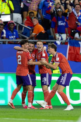 June 13, 2026; Foxborough, Massachusetts, USA; Scotland midfielder Lewis Ferguson (19), Scotland defender Aaron Hickey (2), and Scotland defender Jack Hendry (13) surround Scotland midfielder John McGinn (7) after a goal in a FIFA World Cup, WM, Weltmeisterschaft, Fussball 2026 Group C match between Haiti and Scotland at Boston Stadium. (c) CSM - ZUMAc04_ 20260613_zma_c04_152 Copyright: xBurtxGranofskyx