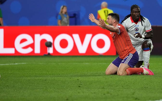 (260614) -- BOSTON, June 14, 2026 -- John McGinn (L) of Scotland reacts during the group C match between Haiti and Scotland at the 2026 FIFA World Cup, WM, Weltmeisterschaft, Fussball at Boston Stadium in Boston, the United States, June 13, 2026. ) (SP)U.S.-BOSTON-FOOTBALL-FIFA WORLD CUP-GROUP C-HTI VS SCO HuangxZongzhi 