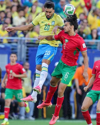 June 14, 2026, East Rutherford, New Jersey, USA: Brazil midfielder LUCAS PAQUET (20) and Morocco midfielder AYYOUB BOUADDI (6) jump for the ball during the 2026 FIFA World Cup, WM, Weltmeisterschaft, Fussball match between Brazil and Morocco at MetLife Stadium in East Rutherford, NJ East Rutherford USA - ZUMAr225 20260614_zsp_r225_003 Copyright: xScottxRausenbergerx