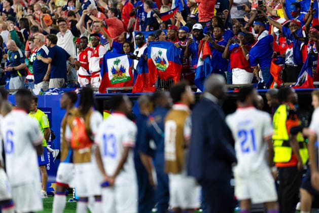 June 13, 2026; Foxborough, Massachusetts, USA; Haiti fans wave the Haitian flag in front of players after a FIFA World Cup, WM, Weltmeisterschaft, Fussball 2026 Group C match between Haiti and Scotland at Boston Stadium. (c) CSM - ZUMAc04_ 20260613_zma_c04_251 Copyright: xBurtxGranofskyx