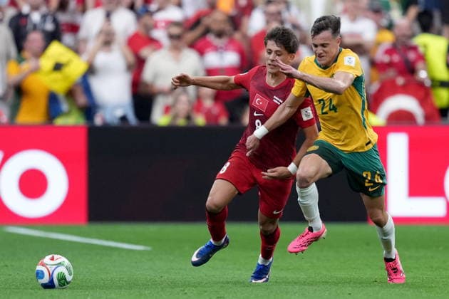 June 13, 2026, Vancouver, Bc, CANADA: Turkey s Arda Guler (8) and Australia s Paul Okon-Engstler (24) race to the ball during first half group D World Cup soccer action, in Vancouver, Saturday, June 13, 2026. AUSTRALIA V. TURKEY  - ZUMAc35_ 20260613_zaf_c35_212 Copyright: xEthanxCairnsx