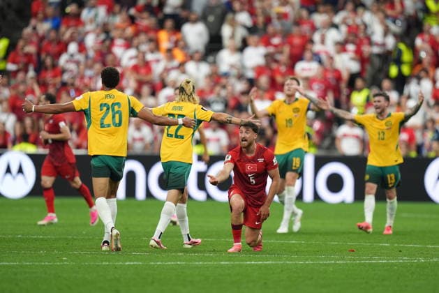 Australia v Turkiye - FIFA World Cup, WM, Weltmeisterschaft, Fussball 2026 - Group D VANCOUVER, CANADA - JUNE 13: Salih Ozcan (5) of Turkiye reacts to referee as he is flanked by Jackson Irvine (22) and Tete Yengi (26) of Australia during the 2026 FIFA World Cup First Stage Group D match between Australia and Turkiye at BC Place Stadium in Vancouver, Canada on June 13, 2026. Ercin Erturk Anadolu British Columbia Canada. Editorial use only. Please get in touch for any other usage.  Copyright: x2026xAnadoluxErcinxErturkx