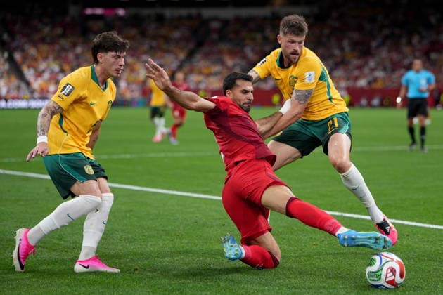 June 13, 2026, Vancouver, Bc, CANADA: Turkey s Zeki Celik (2) tries to move the ball under pressure from Australia s Jordan Bos (5) and teammate Cameron Burgess (21) during first half group D World Cup soccer action, in Vancouver, Saturday, June 13, 2026. AUSTRALIA V. TURKEY  - ZUMAc35_ 20260613_zaf_c35_228 Copyright: xEthanxCairnsx