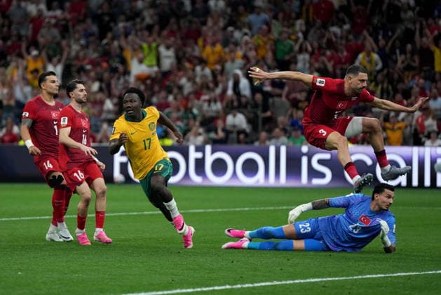 June 13, 2026, Vancouver, Bc, CANADA: Australia s Nestory Irankunda (17) celebrates his goal on Turkey s Ugurcan Cakir (23) as teammate Merih Demiral (3) jumps over him during first half group D World Cup soccer action, in Vancouver, Saturday, June 13, 2026. AUSTRALIA V. TURKEY  - ZUMAc35_ 20260613_zaf_c35_230 Copyright: xDarrylxDyckx