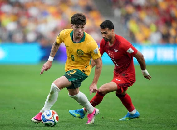 (260614) -- VANCOUVER, June 14, 2026 -- Jordan Bos (L) of Australia vies with Zeki Celik of T¨¹rkiye during the group D match between Australia and T¨¹rkiye at the 2026 FIFA World Cup, WM, Weltmeisterschaft, Fussball at BC Place Vancouver in Vancouver, Canada, June 13, 2026. ) (SP)CANADA-VANCOUVER-FOOTBALL-FIFA WORLD CUP-GROUP D-AUS VS TUR MengxYongmin 