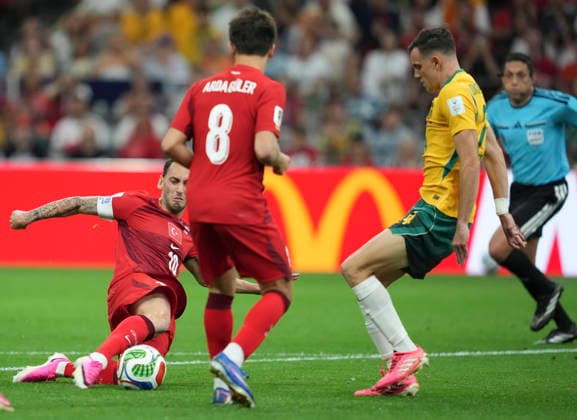 (260614) -- VANCOUVER, June 14, 2026 -- Hakan Calhanoglu (L) of T¨¹rkiye competes during the group D match between Australia and T¨¹rkiye at the 2026 FIFA World Cup, WM, Weltmeisterschaft, Fussball at BC Place Vancouver in Vancouver, Canada, June 13, 2026. ) (SP)CANADA-VANCOUVER-FOOTBALL-FIFA WORLD CUP-GROUP D-AUS VS TUR MengxYongmin 