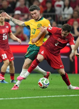 (260614) -- VANCOUVER, June 14, 2026 -- Aiden ONeill (L) of Australia vies with Orkun Kokcu of T¨¹rkiye during the group D match between Australia and T¨¹rkiye at the 2026 FIFA World Cup, WM, Weltmeisterschaft, Fussball at BC Place Vancouver in Vancouver, Canada, June 13, 2026. ) (SP)CANADA-VANCOUVER-FOOTBALL-FIFA WORLD CUP-GROUP D-AUS VS TUR MengxYongmin 
