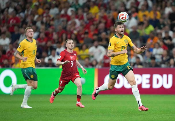 (260614) -- VANCOUVER, June 14, 2026 -- Cameron Burgess (R) of Australia competes during the group D match between Australia and T¨¹rkiye at the 2026 FIFA World Cup, WM, Weltmeisterschaft, Fussball at BC Place Vancouver in Vancouver, Canada, June 13, 2026. ) (SP)CANADA-VANCOUVER-FOOTBALL-FIFA WORLD CUP-GROUP D-AUS VS TUR MengxYongmin 