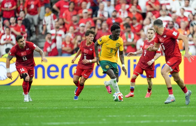 Australia v Turkiye - FIFA World Cup, WM, Weltmeisterschaft, Fussball 2026 - Group D VANCOUVER, CANADA - JUNE 13: Arda Guler (8) of Turkiye in action agaist Mohamed Toure (9) during the 2026 FIFA World Cup First Stage Group D match between Australia and Turkiye at BC Place Stadium in Vancouver, Canada on June 13, 2026. Ercin Erturk Anadolu Vancouver Canada. Editorial use only. Please get in touch for any other usage.  Copyright: x2026xAnadoluxErcinxErturkx