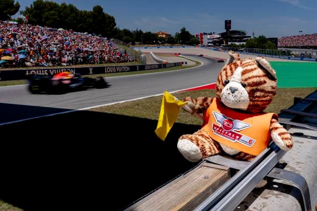 BARCELONA - Marshalls mascot with Formula 1 driver Max Verstappen of Oracle Red Bull Racing in the background during the Formula 1 Spain Catalonia at the Circuit de Barcelona-Catalunya on June 14, 2026 in Barcelona, Spain. (Photo by DeFodi Images) -