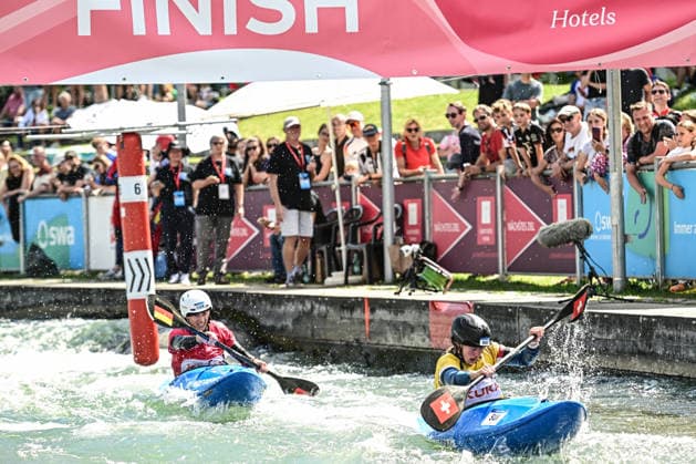 ICF Canoe Slalom World Cup - 14.06.2026, Eis Kanal, Augsburg Ricarda Funk (red) passes the finish as forth after Alena Marx (yellow) (SUI), Augsburg, 14.06.2026 - Canoe World Cup, Kayak Cross Elimination, Augsburg, Eis Kanal