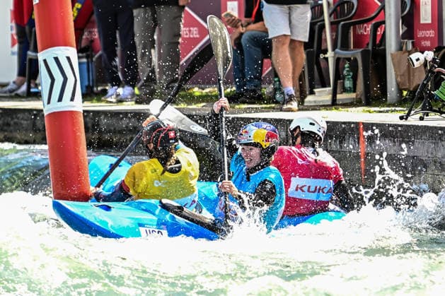 ICF Canoe Slalom World Cup - 14.06.2026, Eis Kanal, Augsburg A fierce battle at the final gate between Evy Leibharth (blue) (USA) , Ricarda Funke (red) (GER) and Alena Marx (yellow) (SUI), Augsburg, 14.06.2026 - Canoe World Cup, Kayak Cross Elimination, Augsburg, Eis Kanal