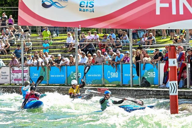 ICF Canoe Slalom World Cup - 14.06.2026, Eis Kanal, Augsburg Final: A fierce battle at the final gate between Ben Haylett (red) (GBR), David Llorente (blue) (ESP) , Joseph Clarke (green) (GBR) and Gabriel de Coster yellow) (BEL),, Augsburg, 14.06.2026 - Canoe World Cup, Kayak Cross Elimination, Augsburg, Eis Kanal