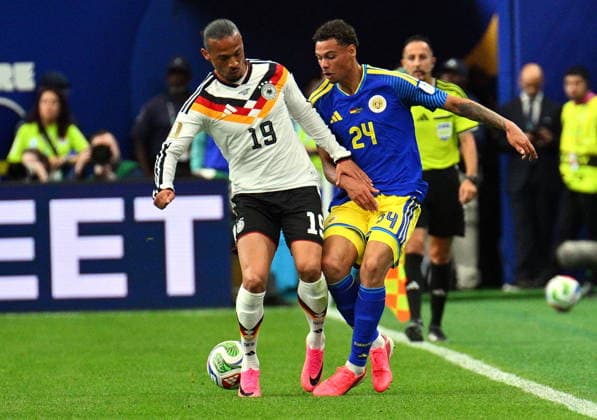 FIFA World Cup, WM, Weltmeisterschaft, Fussball 2026 - Group E - Germany vs Curacao Leroy Sane of Germany (L) and Deveron Fonville of Curacao in action during the FIFA World Cup 2026 group stage match Germany against Curacao, in Houston, USA, 14 June 2026. HOUSTON United States  Copyright: xSAMxWASSONx
