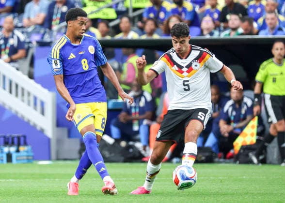 HOUSTON, TX - JUNE 14: Livano Comenencia 8 of Curacao chases Aleksandar PavloviÄ‡ 5 of Germany in the first half during the FIFA World Cup, WM, Weltmeisterschaft, Fussball 2026 Group E match between Germany and Curacao on June 14, 2026 at Houston Stadium in Houston, Texas. (Photo by Leslie Plaza Johnson Icon Sportswire) SOCCER: JUN 14 FIFA World Cup 26 Group E - Germany vs Curacao EDITORIAL USE ONLY Icon260614007