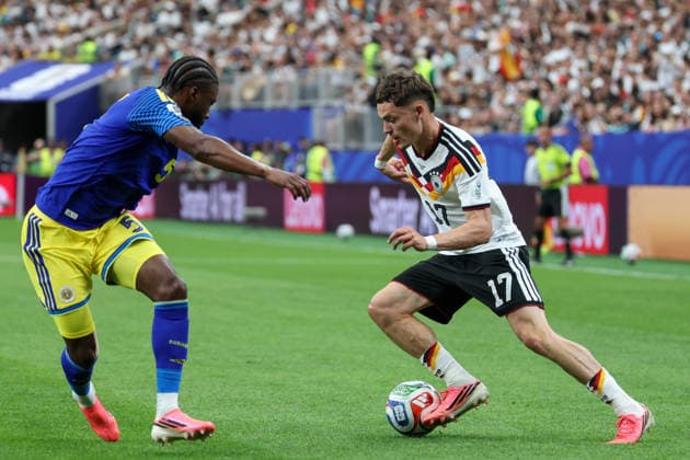 HOUSTON, TX - JUNE 14: Florian Wirtz 17 of Germany controls the ball while being defended by Sherel Floranus 5 of Curacao during the FIFA World Cup, WM, Weltmeisterschaft, Fussball 2026 Group E match between Germany and Curacao on June 14, 2026, at Houston Stadium in Houston, Texas. (Photo by David Buono Icon Sportswire) SOCCER: JUN 14 FIFA World Cup 26 Group E - Germany vs Curacao EDITORIAL USE ONLY Icon260614018