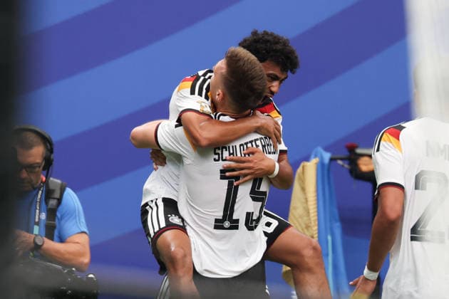 HOUSTON, TX - JUNE 14: Nico Schlotterbeck 15 of Germany and Nathaniel Brown 18 of Germany celebrate their corner kick goal during the FIFA World Cup, WM, Weltmeisterschaft, Fussball 2026 Group E match between Germany and Curacao on June 14, 2026, at Houston Stadium in Houston, Texas. (Photo by David Buono Icon Sportswire) SOCCER: JUN 14 FIFA World Cup 26 Group E - Germany vs Curacao EDITORIAL USE ONLY Icon260614028
