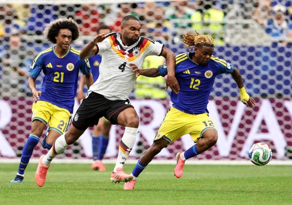 (260615) -- HOUSTON, June 15, 2026 -- Jonathan Tah (C) of Germany vies with Sontje Hansen (R) of Curacao during the group E match between Germany and Curacao at the 2026 FIFA World Cup, WM, Weltmeisterschaft, Fussball at Houston Stadium in Houston, the United States, June 14, 2026. Li Ming) (SP)U.S.-HOUSTON-FOOTBALL-FIFA WORLD CUP-GROUP E-GER VS CUW XiaxYifang 