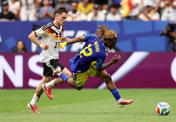 (260615) -- HOUSTON, June 15, 2026 -- Florian Wirtz (L) of Germany vies with Sontje Hansen of Curacao during the group E match between Germany and Curacao at the 2026 FIFA World Cup, WM, Weltmeisterschaft, Fussball at Houston Stadium in Houston, the United States, June 14, 2026. Li Ming) (SP)U.S.-HOUSTON-FOOTBALL-FIFA WORLD CUP-GROUP E-GER VS CUW XiaxYifang 