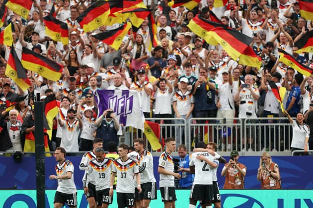 HOUSTON, TX - JUNE 14: Deniz Undav 26 of Germany is hugged by Antonio Rüdiger 2 of Germany after scoring a goal as fans waive flags in the background during the FIFA World Cup, WM, Weltmeisterschaft, Fussball 2026 Group E match between Germany and Curacao on June 14, 2026, at Houston Stadium in Houston, Texas. (Photo by David Buono Icon Sportswire) SOCCER: JUN 14 FIFA World Cup 26 Group E - Germany vs Curacao EDITORIAL USE ONLY Icon260614051