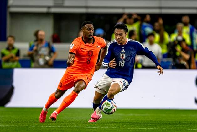 DALLAS - (lr) Ryan Gravenberch of the Netherlands and Ayase Ueda of Japan during the Netherlands vs. Japan match at the 2026 World Cup at AT&T Stadium on June 14, 2026, in Dallas, United States. (Photo by Stefan Koops EYE4IMAGES DeFodi Images) -