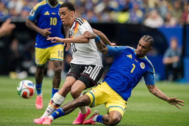 June 14, 2026: Curacao midfielder JUNINHO BACUNA (7) stops Germany midfielder JAMAL MUSIALA (10) during the FIFA World Cup, WM, Weltmeisterschaft, Fussball 2026 Group E between Germany and CuraÂao at Houston Stadium in Houston, Texas, USA, on June 14, 2026. - ZUMAp213 20260614_znp_p213_007 Copyright: xLynnxPenningtonx