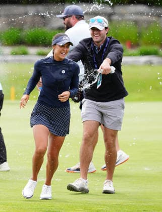 MIDLAND, MI - JUNE 14: LPGA, Golf Damen golfer Yana Wilson gets doused by water from her caddie on June 14, 2026, after winning the LPGA Dow Championship at Midland Country Club in Midland, Michigan. (Photo by Brian Spurlock Icon Sportswire) GOLF: JUN 14 LPGA Dow Championship EDITORIAL USE ONLY Icon26061468