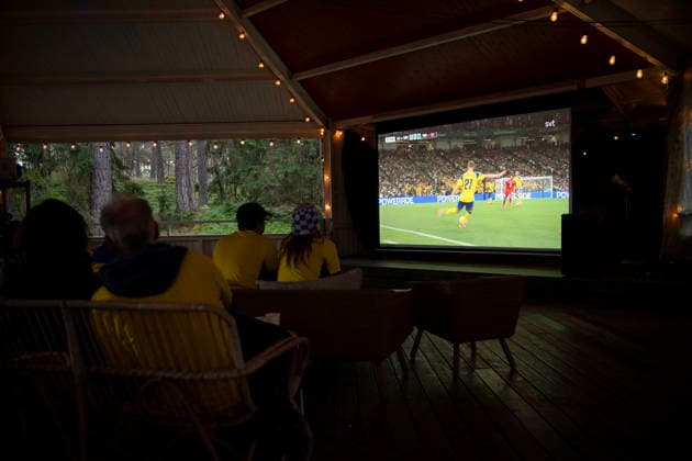 260615 Swedish fans watch the FIFA World Cup, WM, Weltmeisterschaft, Fussball match between Sweden and Tunisia on a big screen TV in a dance pavilion on June 15, 2026 in Ekerö, Sweden. Photo: Niklas Larsson BILDBYRAN kod NL NL0016 fotboll football soccer fotball vm sverige-tunisien bbeng genre Sverige Tunisien folkhemmet storbilds-tv