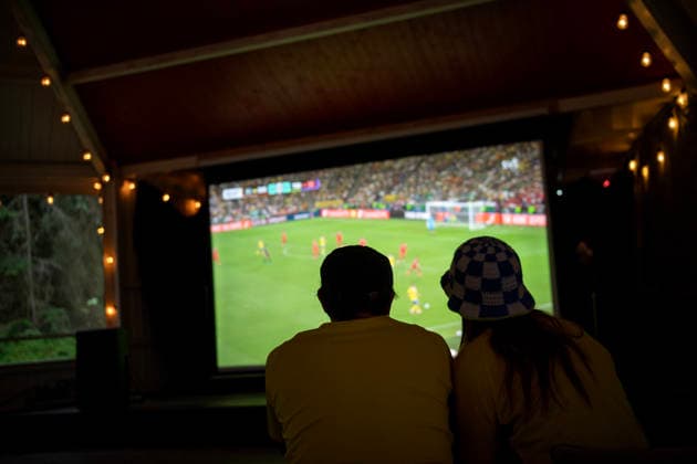 260615 Swedish fans watch the FIFA World Cup, WM, Weltmeisterschaft, Fussball match between Sweden and Tunisia on a big screen TV in a dance pavilion on June 15, 2026 in Ekerö, Sweden. Photo: Niklas Larsson BILDBYRAN kod NL NL0016 fotboll football soccer fotball vm sverige-tunisien bbeng genre Sverige Tunisien folkhemmet storbilds-tv
