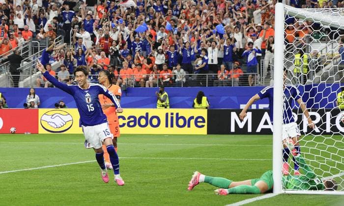 Football: 2026 World Cup Japan s Daichi Kamada (far L) reacts after scoring the team s second goal in the second half of a World Cup Group F football match against the Netherlands at Dallas Stadium in Arlington, Texas, on June 14, 2026.  A14AA0005618833P