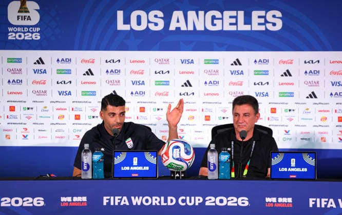 (260615) -- LOS ANGELES, June 15, 2026 -- Iran s head coach Amir Ghalenoei (R) and player Mehdi Taremi attend a press conference, PK, Pressekonferenz at Los Angeles Stadium in Los Angeles, the United States, on June 14, 2026. ) (SP)U.S.-LOS ANGELES-FOOTBALL FIFA World Cup, WM, Weltmeisterschaft, Fussball PRESS CONFERENCE-IRAN BaixXuefei 
