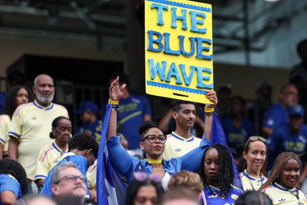 HOUSTON, TX - JUNE 14: A Curacao fan holds up The Blue Wave sign ahead of the FIFA World Cup, WM, Weltmeisterschaft, Fussball 2026 Group E match between Germany and Curacao on June 14, 2026, at Houston Stadium in Houston, Texas. (Photo by David Buono Icon Sportswire) SOCCER: JUN 14 FIFA World Cup 26 Group E - Germany vs Curacao EDITORIAL USE ONLY Icon260614072