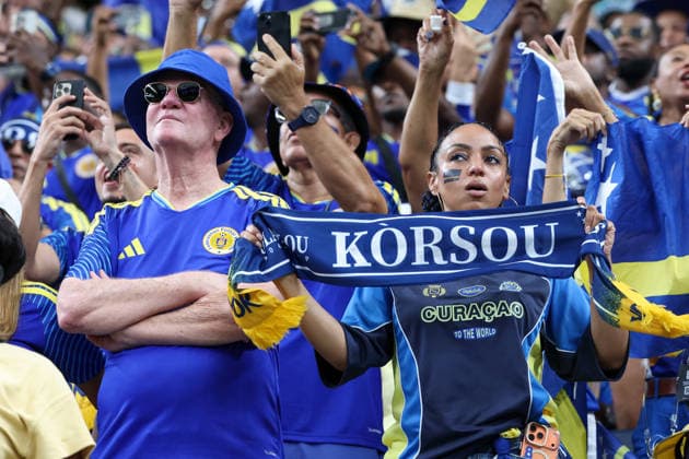 HOUSTON, TX - JUNE 14: A Curacao fan holds up a Korsou scarf to support her team ahead of the FIFA World Cup, WM, Weltmeisterschaft, Fussball 2026 Group E match between Germany and Curacao on June 14, 2026, at Houston Stadium in Houston, Texas. (Photo by David Buono Icon Sportswire) SOCCER: JUN 14 FIFA World Cup 26 Group E - Germany vs Curacao EDITORIAL USE ONLY Icon260614090