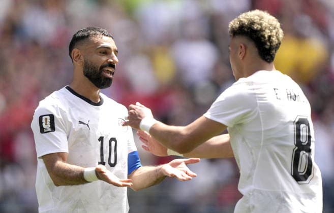 FIFA World Cup, WM, Weltmeisterschaft, Fussball 2026 - Group G - Belgium vs Egypt Emam Ashour (R) of Egypt celebrates with teammate Mohamed Salah (L) after scoring the opening goal during the FIFA World Cup 2026 group stage match Belgium against Egypt, in Seattle, USA, 15 June 2026. SEATTLE United States  Copyright: xSTEPHENxBRASHEARx