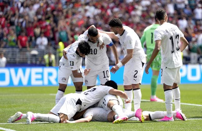 FIFA World Cup, WM, Weltmeisterschaft, Fussball 2026 - Group G - Belgium vs Egypt Emam Ashour (bottom) of Egypt celebrates with teammates after scoring the opening goal during the FIFA World Cup 2026 group stage match Belgium against Egypt, in Seattle, USA, 15 June 2026. SEATTLE United States  Copyright: xSTEPHENxBRASHEARx