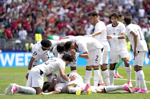 FIFA World Cup, WM, Weltmeisterschaft, Fussball 2026 - Group G - Belgium vs Egypt Emam Ashour (bottom) of Egypt celebrates with teammates after scoring the opening goal during the FIFA World Cup 2026 group stage match Belgium against Egypt, in Seattle, USA, 15 June 2026. SEATTLE United States  Copyright: xSTEPHENxBRASHEARx