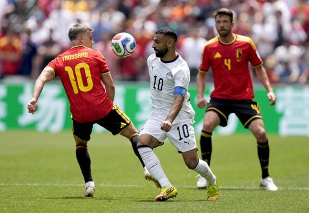 FIFA World Cup, WM, Weltmeisterschaft, Fussball 2026 - Group G - Belgium vs Egypt Leandro Trossard (L) and Brandon Mechele of Belgium in action against Mohamed Salah (C) of Egypt during the FIFA World Cup 2026 group stage match Belgium against Egypt, in Seattle, USA, 15 June 2026. SEATTLE United States  Copyright: xSTEPHENxBRASHEARx