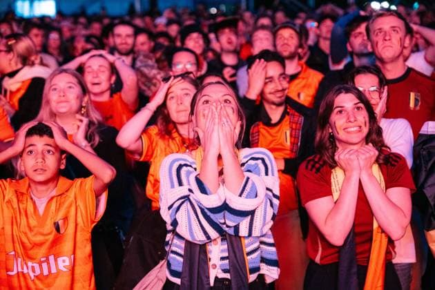 Supporters react during a soccer game between Belgian national team, Nationalteam Red Devils and Egypt, on a big screen in Brussels, on Monday 15 June 2026, the first game in the group stage of the FIFA World Cup, WM, Weltmeisterschaft, Fussball 2026 in the United States of America. The Diables Rouges - Rode Duivels were drawn into Group G. MARIUS BURGELMAN MariusxBurgelman  x177815469x