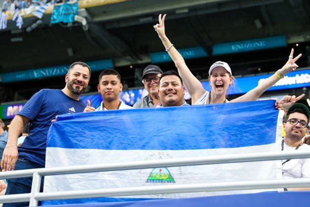MIAMI GARDENS, FL - JUNE 15: Uruguay supporters pose for a photograph during a FIFA World Cup, WM, Weltmeisterschaft, Fussball 2026 Group H match between Saudi Arabia and Uruguay on June 15, 2026 at Miami Stadium, in Miami Gardens, Fla.(Photo by Chris Arjoon Icon Sportswire) SOCCER: JUN 15 FIFA World Cup 26 Group H - Saudi Arabia vs Uruguay EDITORIAL USE ONLY Icon26061500100022