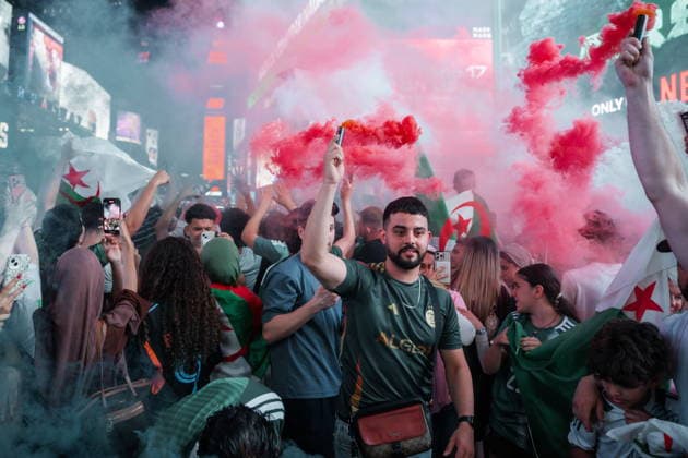 Argentina fan celebrates in Times Square ahead of FIFA World Cup, WM, Weltmeisterschaft, Fussball 2026 match Algerian soccer fans set off flares as hundreds of soccer fans flood Times Square, in New York, New York, USA, 15 June 2026. NEW YORK New York United States  Copyright: xOlgaxFedorovax