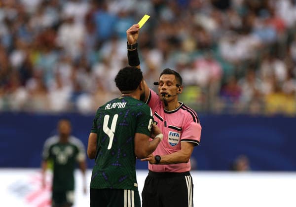 (260616) -- MIAMI, June 16, 2026 -- The referee gives a yellow card to Abdulelah Alamri of Saudi Arabia during the group H match between Saudi Arabia and Uruguay at the 2026 FIFA World Cup, WM, Weltmeisterschaft, Fussball at Miami Stadium, Miami, the United States, June 15, 2026. ) (SP)U.S.-MIAMI-FOOTBALL-FIFA WORLD CUP-GROUP H-KSA VS URU XuxZijian 